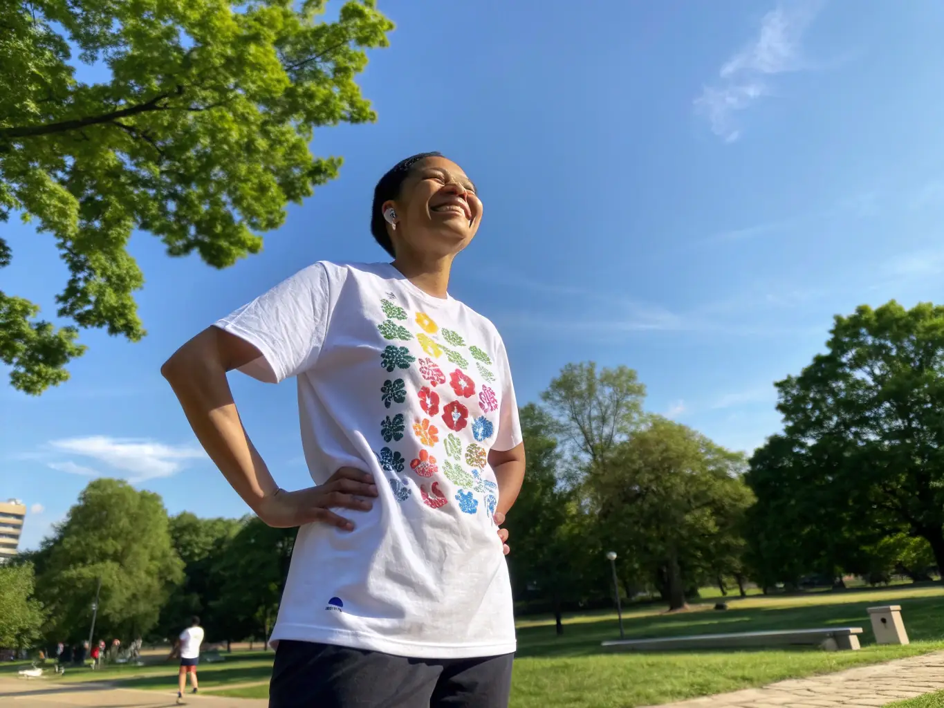 A lifestyle image featuring a person wearing a Casual Play Shirts t-shirt with an inspiring quote, paired with one of the brand's neckties, in a casual outdoor setting.